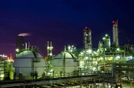 Gas storage spheres tank in petrochemical plant at nightの写真素材