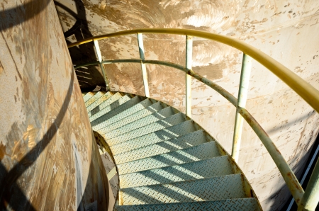 steel spiral down stairs on storage tankの写真素材