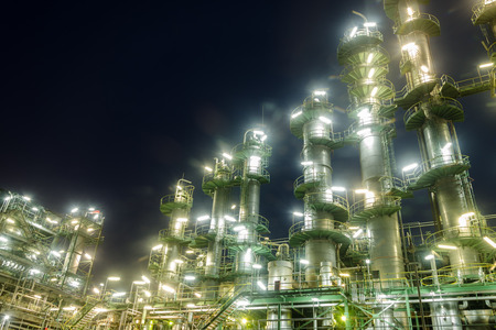 Column tower in petrochemical plant at nightのeditorial素材