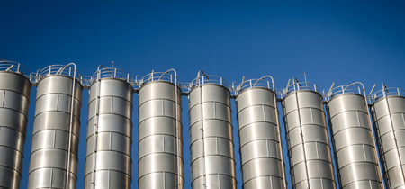 Industrial silos in the chemical industry and blue sky backgroundの写真素材