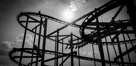 black and white roller coaster track in amusement park.の写真素材