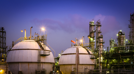 Gas storage spheres tank in petrochemical plant at nightの写真素材