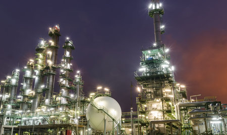 petrochemical plant column tower at twilight