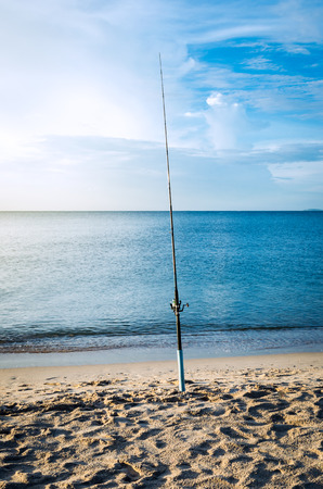 fishing rod on the beach at morning.の写真素材