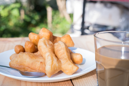 Chinese Bread Stick or Chinese Donut with Thai Traditional Coffee Time in the Morningの写真素材