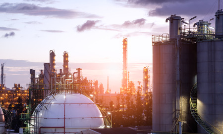 Gas storage spheres tank in oil refinery plant on sky sunrise backgroundの写真素材