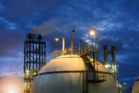 Gas storage spheres tank in refinery plant at twilight column tower backgroundの写真素材