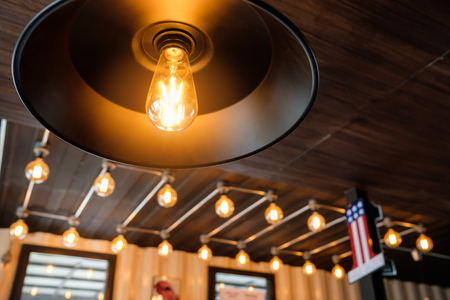 Vintage light bulb in coffee shop,classic and retro concept style.
Light bulb incandescent hanging decorated interior room.の写真素材