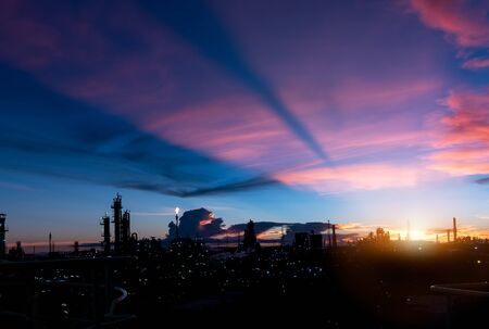 silhouette factory with dramatic sky background,petrochemical plant area with beautify sky at sunset.industry factory at sunset time.の写真素材