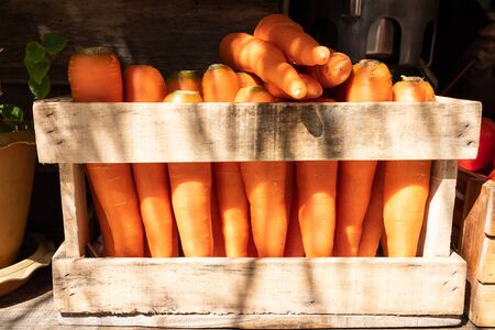 Fresh carrot in wooden box,Carrots in wooden box on sale in market.の写真素材