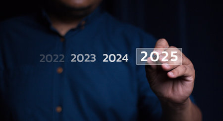 Trends 2025 year concept. Woman hold laptop and point finger touching virtual sequence count down years 2025 wording for marketing monitor business planning in new year. Technologyの写真素材