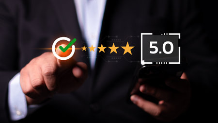 Businessman using smartphone give rating to service experience on online application, 5-star satisfaction, satisfaction feedback review, good quality most.の写真素材