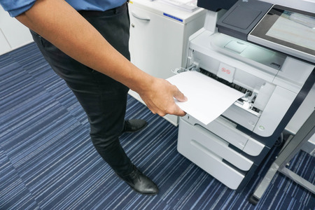 A man is printing document  copy a documentの写真素材