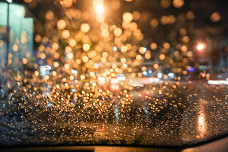 Bokeh Raindrops on the wind shield at nightの写真素材