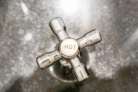 faucet for hot water in the bathroomの写真素材