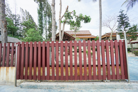 red wooden slide front door of houseの写真素材