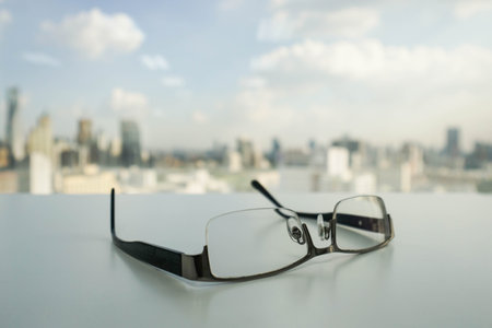 men black glasses on the office deskの写真素材