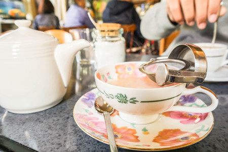 hot milk tea in ceramic cup in cafeの写真素材