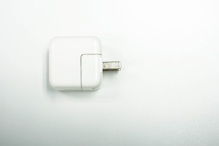 isolated white smartphone chargerの写真素材