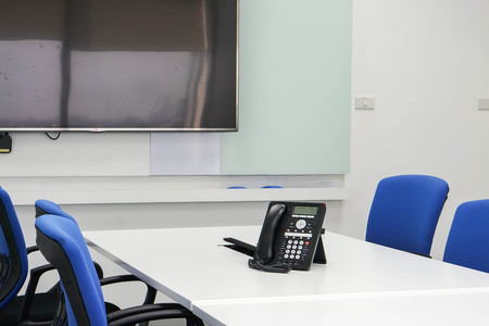 IP phone on table in boardroom for conference meetingの写真素材