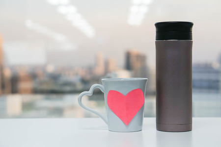 thermos bottle with cup of loveの写真素材