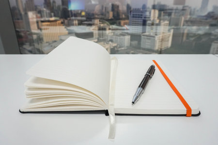 isolated mock up notepad for taking minutes with luxury pen in office
