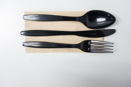 isolated utensil of spoon, fork and knife on dining table