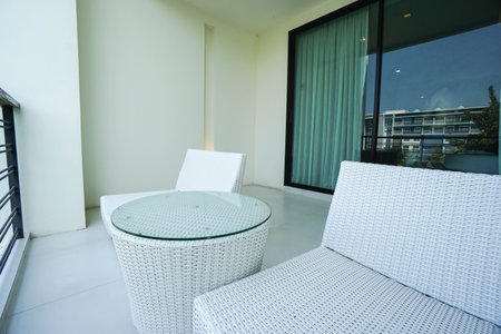 close up luxury white chair at balcony in hotelの写真素材