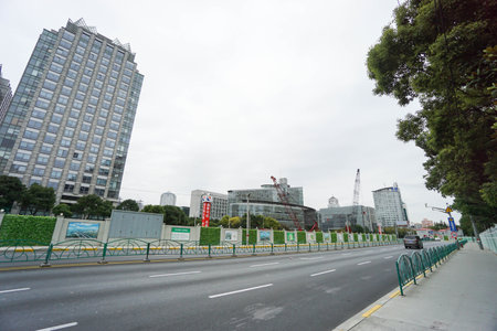 modern building under construction along roadside taken in Shanghai on 16 November 2016のeditorial素材