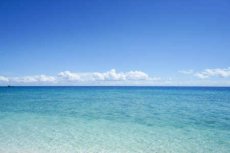 clear blue sea water with bright blue skyの写真素材