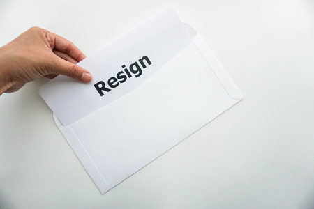 business concept of isolated woman hold resignation letter in left handの写真素材