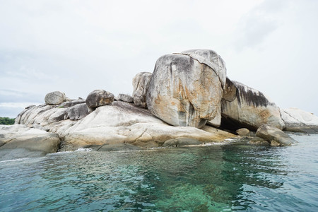 giant rock in the clear blue seaの写真素材
