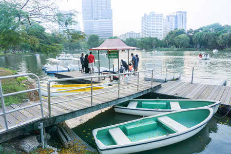 parents and kid prepare to get in boat and water cycle in public park taken in Lumpini Park Bangkok Thailand on 31 May 2017のeditorial素材