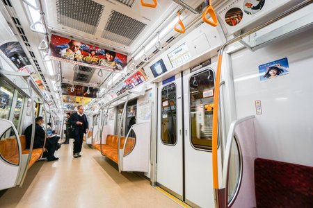 people, seat and interior inside subway train taken in Tokyo Japan on 9 December 2016のeditorial素材