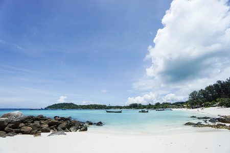 landscape of white sand with rocks and people enjoy on the bench on holidaysの写真素材