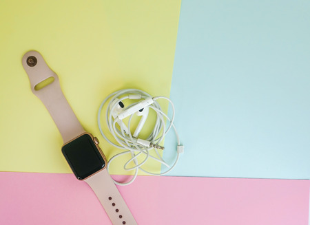 smart watch with headphones in pastel minimal backgroundの写真素材