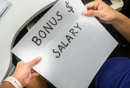 close up boss inform new salary and annual bonus to the employeeの写真素材