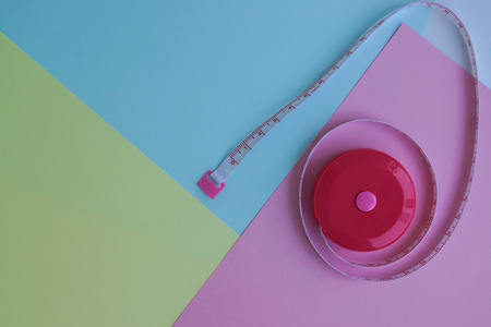 health and diet icon - cute measurement tape on pastel backgroundの写真素材