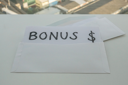 business icon - open white envelope for yearly bonusの写真素材