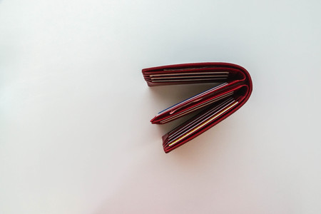 finance and shopping concept - isolated top view of men leather red walletの写真素材
