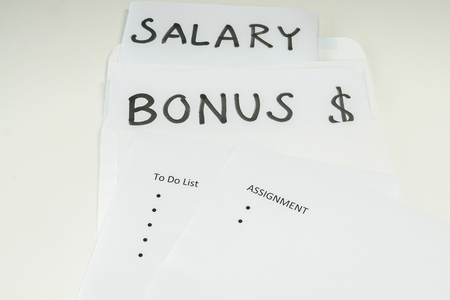 business concept - isolated bonus and salary evaluation based on assignment and goal for employee performance reviewの写真素材