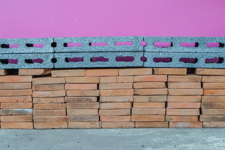 stacks of concrete and orange brick for constructionの写真素材