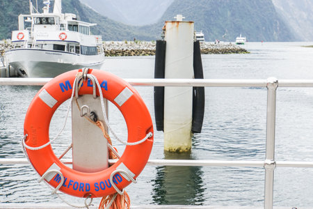 life buoy at port for safety taken in Milford Sound New Zealand on 3 November 2017のeditorial素材
