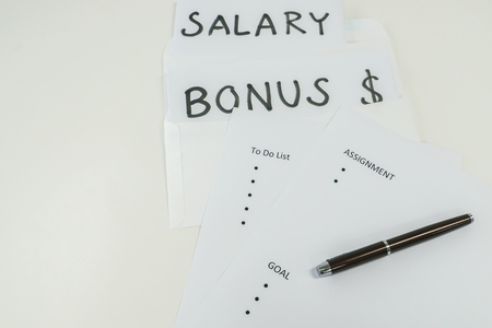 isolated handwritten salary and bonus with business assignment and goalsの写真素材