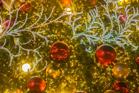 selective focus close up of glow and glitter Christmas tree decorative ornamentの写真素材