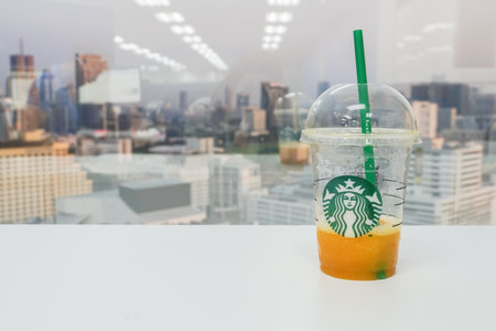 illustrative editorial selective focus residue blended mango passion fruit in Starbucks plastic glassのeditorial素材