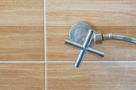 close up old shower faucet in bathroom