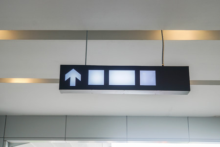 direction and mock up sign post inside the shopping mallの写真素材