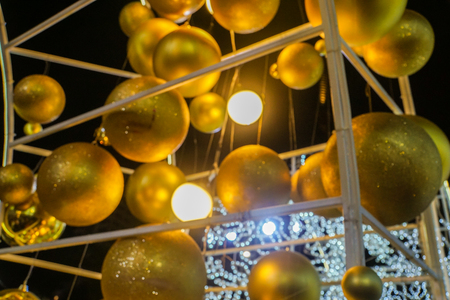 blurred golden glitter decorative balls for Christmas festiveの写真素材