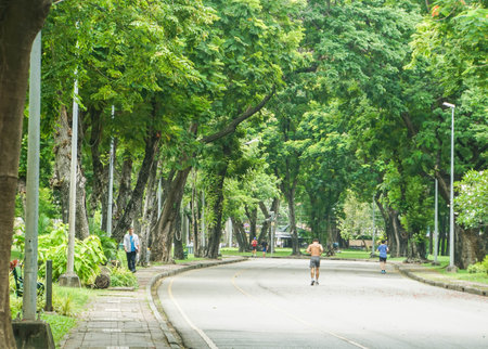Bangkok / Thailand - August 14 2018: People jogging on concrete track in Lumpini Parkのeditorial素材